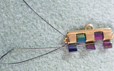 Bracciale polsino multirow in perline di Tila, perline rotonde in vetro ceco e perline 15 : Tappa 8