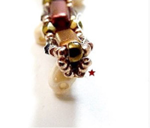 Passo 16 - Fai da te Tinaya collana perle di vetro Puca