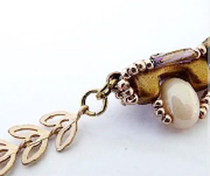 Passo 19 - Fai da te Tinaya collana perle di vetro Puca