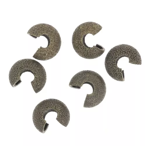 Coprischiaccini brillantinati 5.5 mm bronzo x50