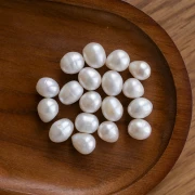 Perla d'acqua dolce ovale irregolare 11x10 mm - Grado A Bianco x1