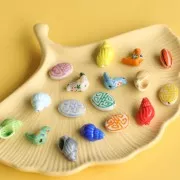 Perla ovale piatta in ceramica 19x14 mm - motivo azteco - Bianco - Giallo x1