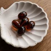 Perla di oliva 21x15 mm in resina traslucida - Ambra marmorizzata x1