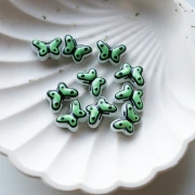 Perle di vetro a farfalla 14x10 mm - Verde salvia - Nero x1