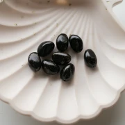 Perle irregolari di 13,5x9 mm in resina opaca - Nero con Brillantini x8