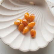 Perle irregolari 13,5x9 mm in resina traslucida - Albicocca marmorizzato x8