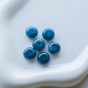 Perle rotonde 12x7 mm in resina opaca - Blu petrolio marmorizzato x6