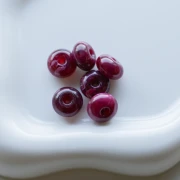 Perle rotonde 12x7 mm in resina opaca - Granato marmorizzato x6