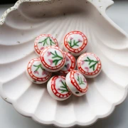 Perla piatta rotonda in ceramica da 19 mm - fiori - Bianco - Rosa x1