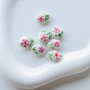 Perla ovale in ceramica 15,5x12,5 mm - Motivo floreale - Bianco - Rosa - Verde x1
