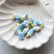 Perla di ghiaccio in ceramica 15x8 mm - Blu - Bianco x1