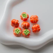 Perlina pomodoro in ceramica da 16 mm - Arancione - Verde x1