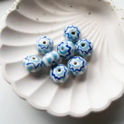 Perlina tonda in ceramica 15x10,5 mm - Azzurro - Blu scuro x1