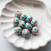 Perlina rotonda in ceramica 15x10,5 mm - Turchese - Rosso x1