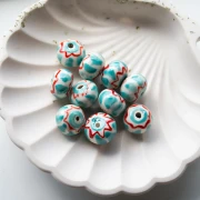 Perlina rotonda in ceramica 15x10,5 mm - Turchese - Rosso x1