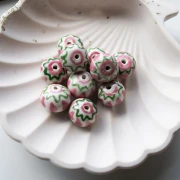 Perla rotonda in ceramica 15x10,5 mm - Rosa chiaro - Verde x1
