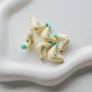 Perlina uccello in ceramica 15x21 mm - Beige - Turchese x1