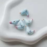Perlina uccello in ceramica 15x21 mm - Azzurro - Rosa x1