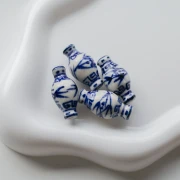 Vaso di perle in ceramica 14x27 mm - Bianco - Blu x1
