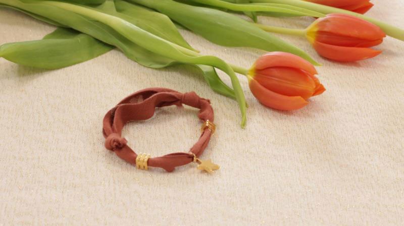 Bracciale scorrevole con ciondolo a stella placcato oro