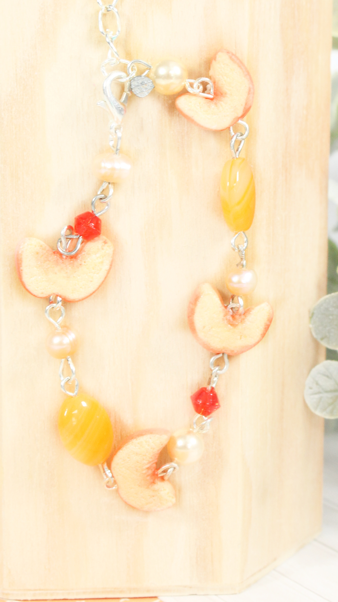 Schema Bracciale misto di pesca e perline in argilla polimerica