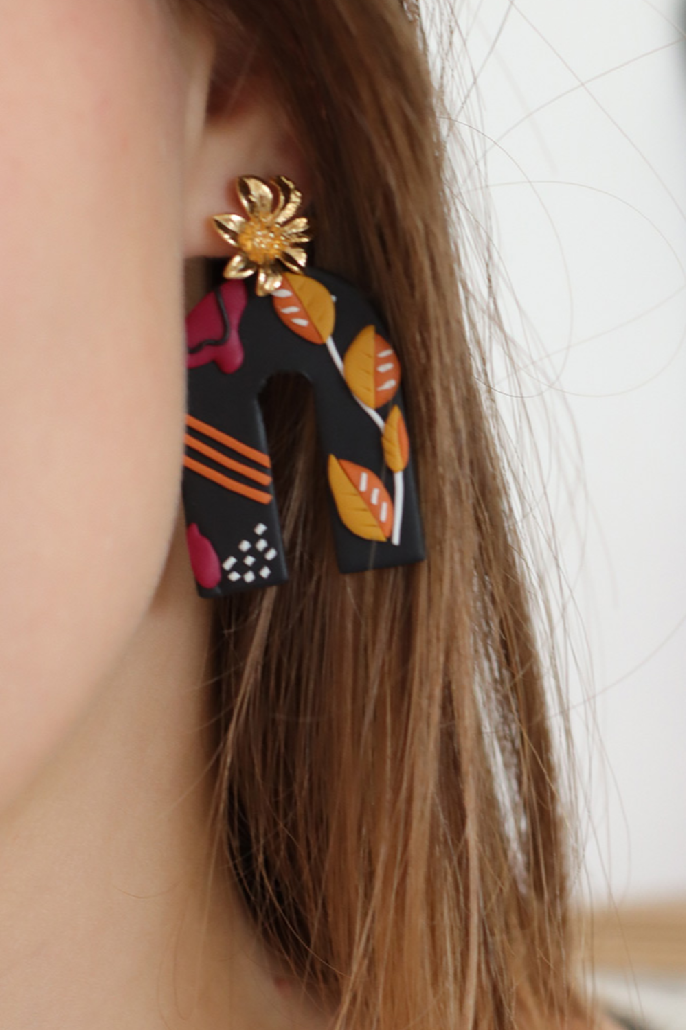 Orecchini tecnica a lastre polimeriche